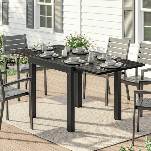 Mesa de jantar extensível para exterior, 80160 cm, para 4 a 6 pessoas, em alumínio com tampo ripado, efeito madeira, preta. Mesa de jantar extensível para exterior, 80160 cm, para 4 a 6 pessoas, em alumínio com tampo ripado, efeito madeira, preta.