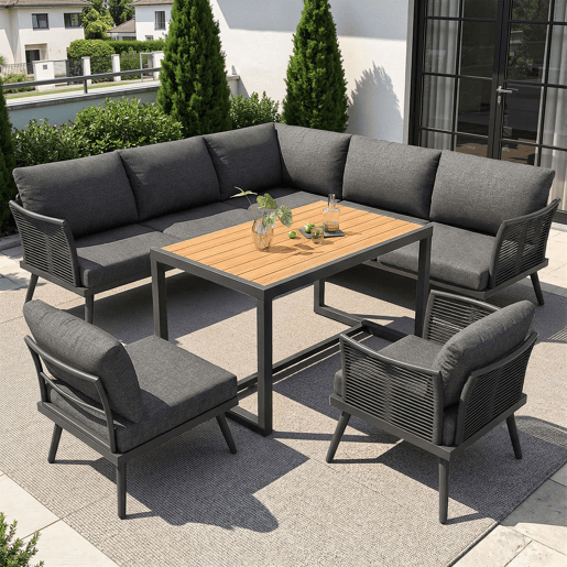 Sofá de jardim de canto com 7 lugares, com mesa de centro e poltrona - Conjunto modular resistente às intempéries, com estrutura de ferro, braços trançados e almofadas - Cinzento Sofá de jardim de canto com 7 lugares, com mesa de centro e poltrona - Conjunto modular resistente às intempéries, com estrutura de ferro, braços trançados e almofadas - Cinzento