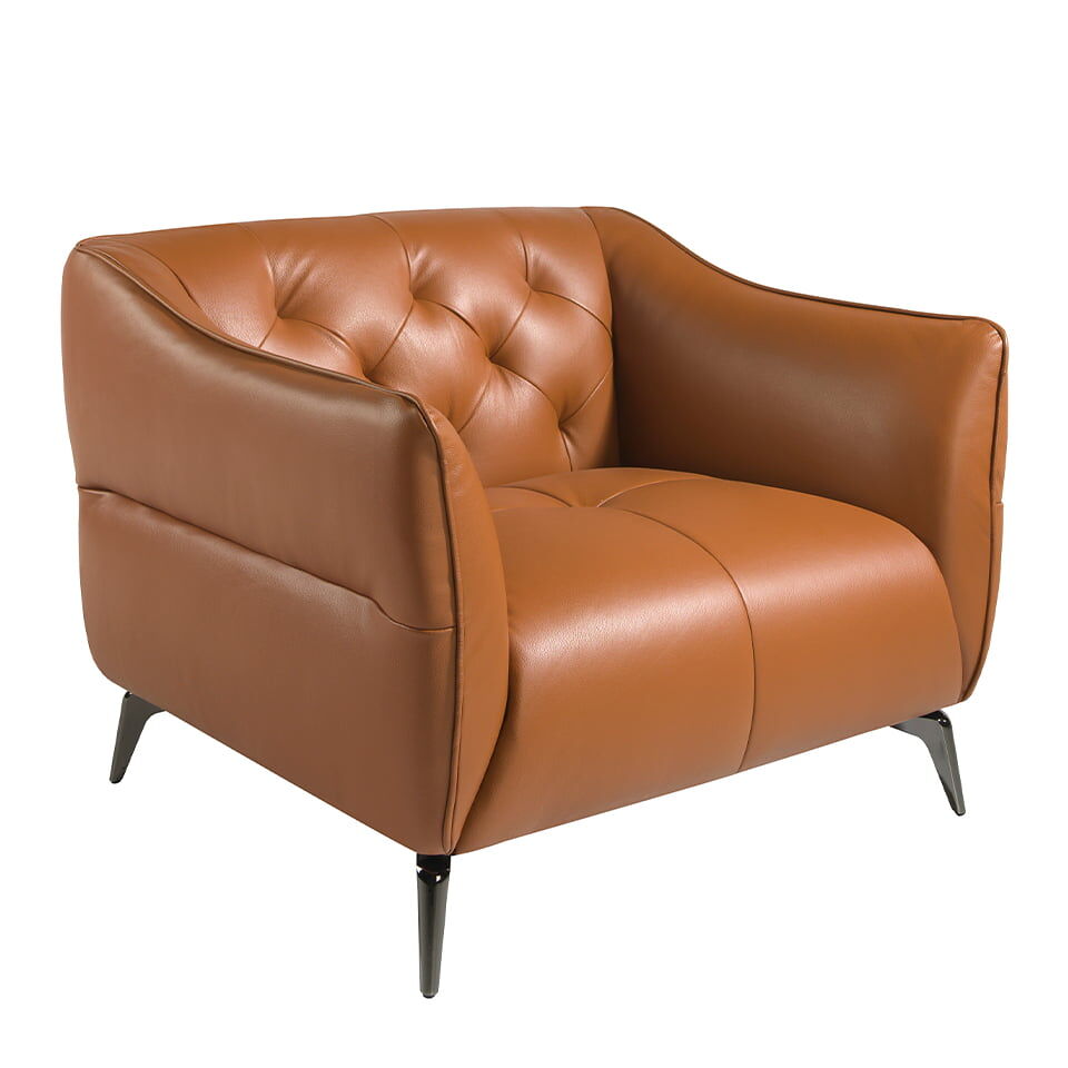 Sillón tapizado en piel con capitoné