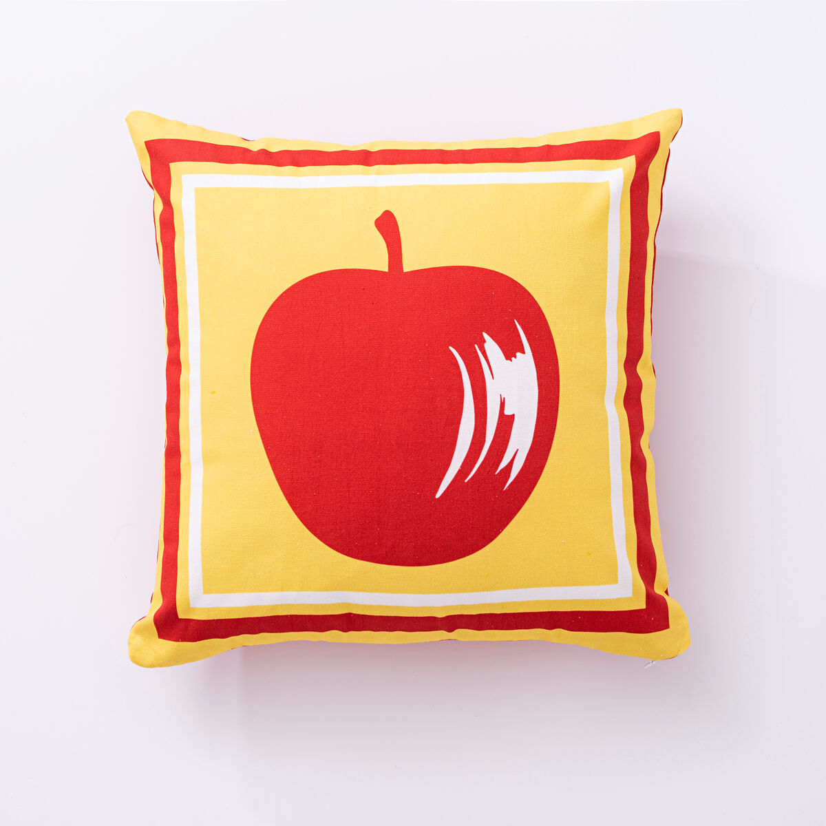 Cojín de 40x40cm 144tc 100%algodón amarillo con manzana roja de la colección fruits de la marca united colors of benetton