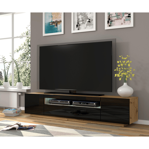 A mesa de TV AURA num estilo moderno. Mede 42x200x37 cm e inclui 4 prateleiras e 3 portas.