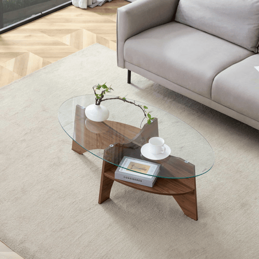 Mesa de café ovalada - 104,9 x 60 cm - Estrutura em madeira de nogueira com prateleiras dispostas diagonalmente e nível de armazenamento integrado - Cor transparente, nogueira
